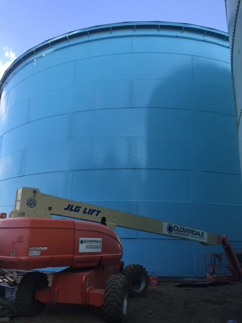 Freshly painted water tank in Allentown, PA behind jig lift machine
